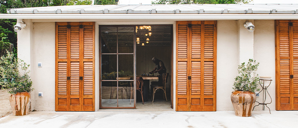 The front of Bellesguart with its wooden doors open onto the dining room